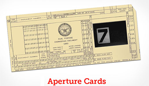 The closest I can think of are Aperture Cards, which are a fun combination of microform and punch cards. Basically you embed some microfilm into a punch card.