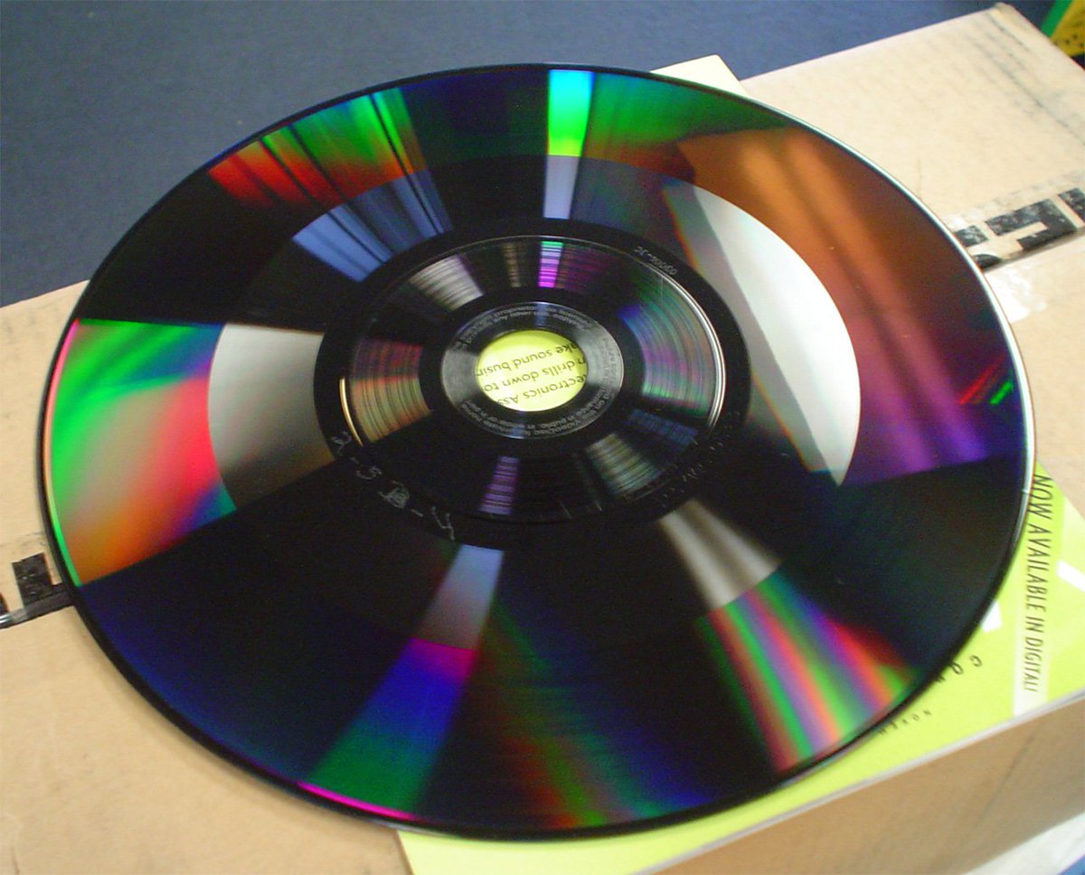 There's also the capacitive-disc variant of vinyl. It's basically the same idea, just the groove is now only a stabilizer for the player's head, and the data is encoded in the depth of the groove.