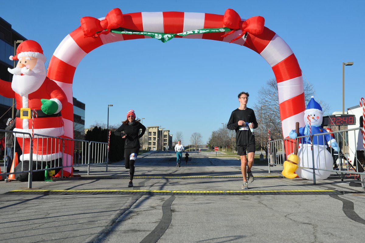 DanicaTormohlen's tweet photo. Crossing the finish line of an in-person race with my son during #COVID19. Priceless! 1st Female Finisher in the #GreatSantaRun (of 266 female runners). Very pleasant surprise! Trying to appreciate the silver linings ... https://t.co/cxlBQKc37V https://t.co/oWXEXRztUu