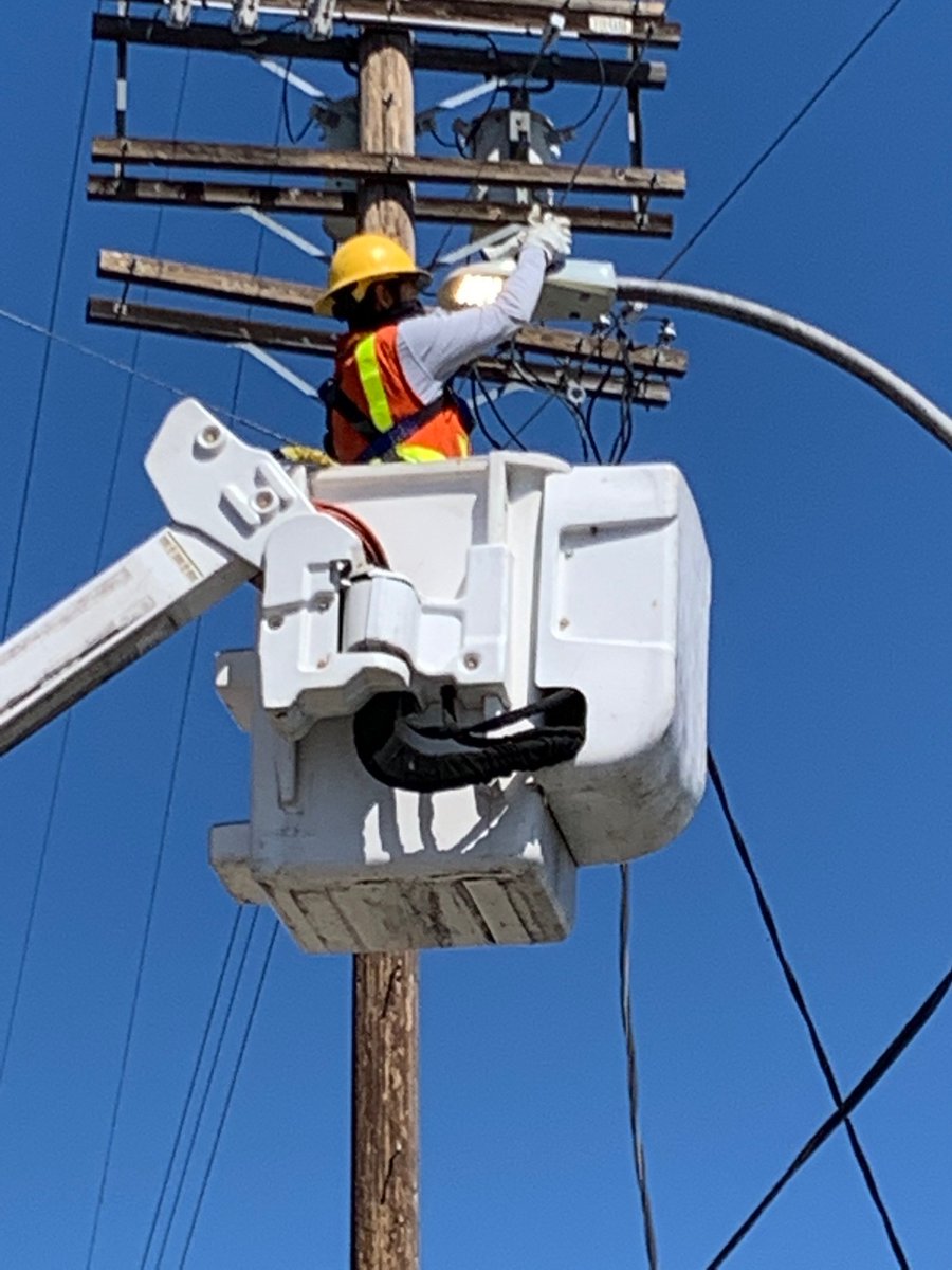 A City of L.A. Bureau of Street Lighting worker repairs a city street light