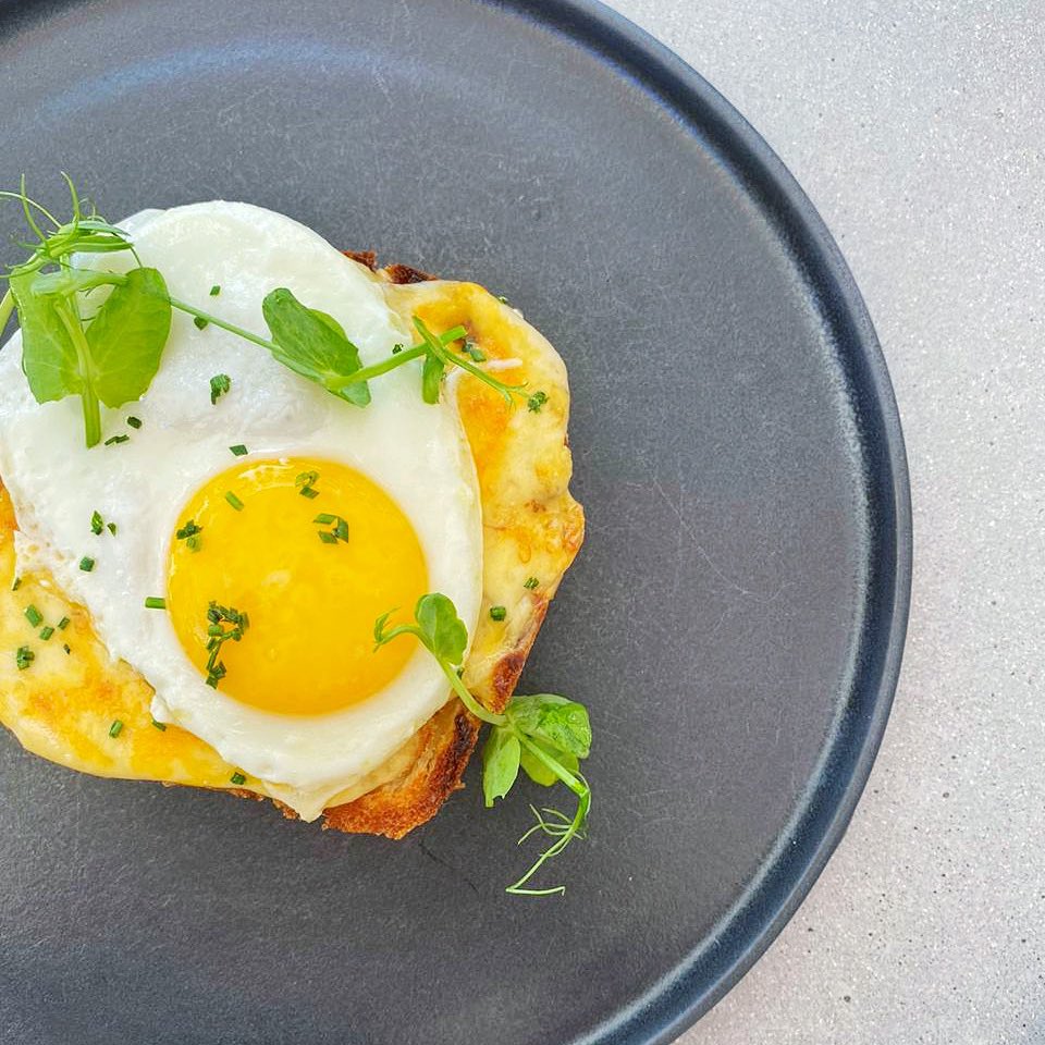 Turn a “good morning” into a great morning with our Croque Madame! Available Wednesday to Friday, enjoy our milk loaf, filled with smoked Stanford &amp; cheddar mornay sauce, wholegrain mustard, gypsy ham - and a fried egg - for R100. The best part? We’ll give you coffee, on us!
