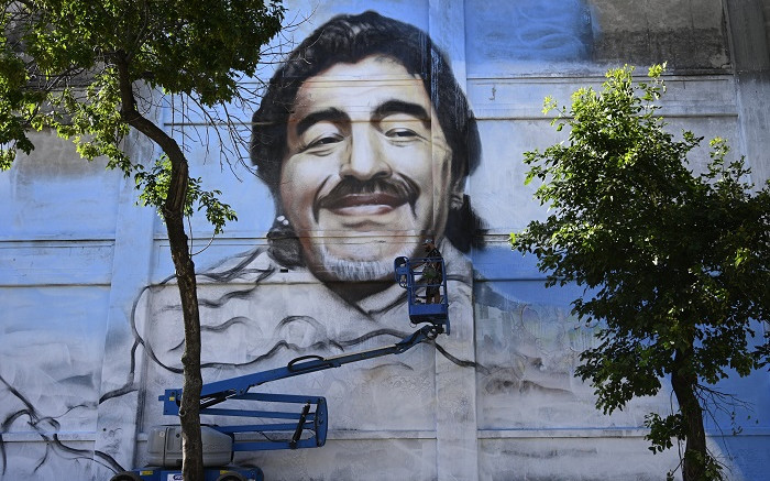 Street artist unveils mural to 'Saint' Diego Maradona