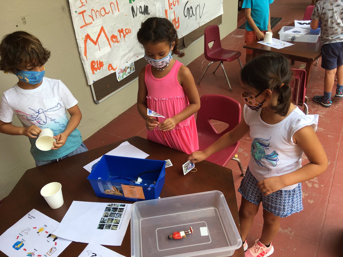 KG STEM challenge. Use limited resources to design a structure to keep the toy dry when it ‘rains’ Creative thinking helps us solve problems. #howtheworldworks #AISMlearns