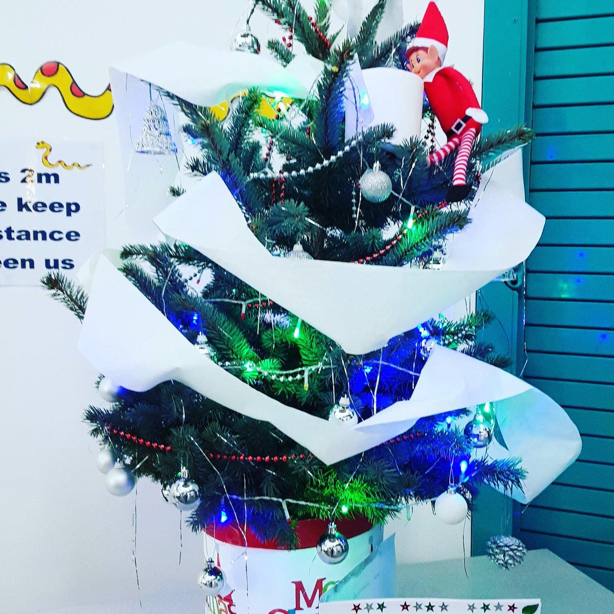 Elfie trying to decorate our tree in reception.