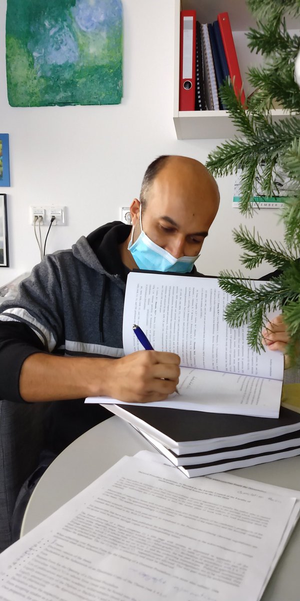 RCOF8's tweet photo. @f_hossain19 signing his thesis he is about to hand in! #PhD @wissen_lockt @UMGreifswald https://t.co/mg6ZQ2cDzV