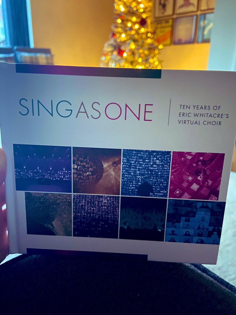 Nyree_Marsh's tweet photo. Completely forgot I had ordered this a few weeks ago, which has just arrived. I bought this as a wee keepsake from taking part in @EricWhitacre ‘s #VC6 during the summer. Such a beautiful book and I can’t believe my name is in it too! 🎶🥺😯 
Merry Christmas to me 🥰🎁✨ https://t.co/E9eSeYaucI
