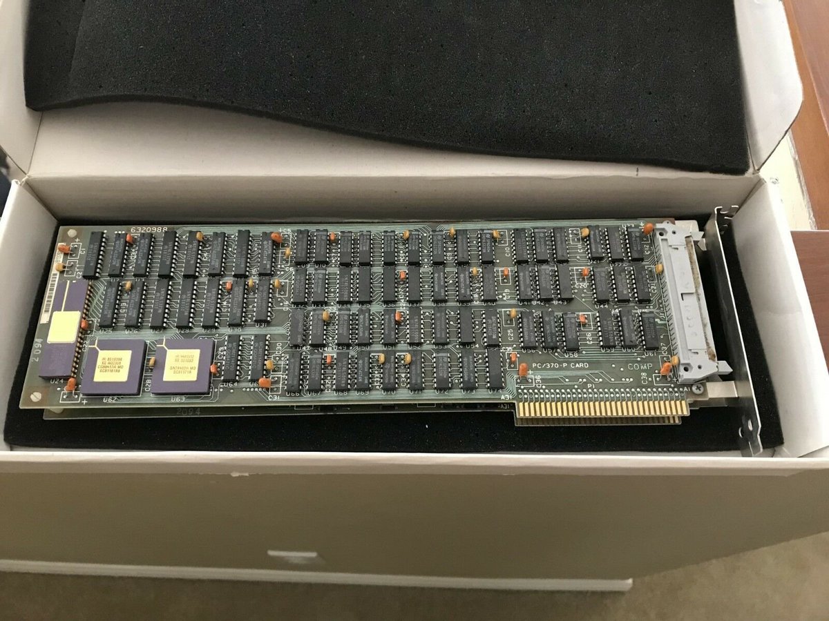 the answer is that it's this ISA card. it's designed to drop into an IBM XT computer. it's a bunch of TTL logic, but there are three devices on the far left with gold plated lids that are rather special.