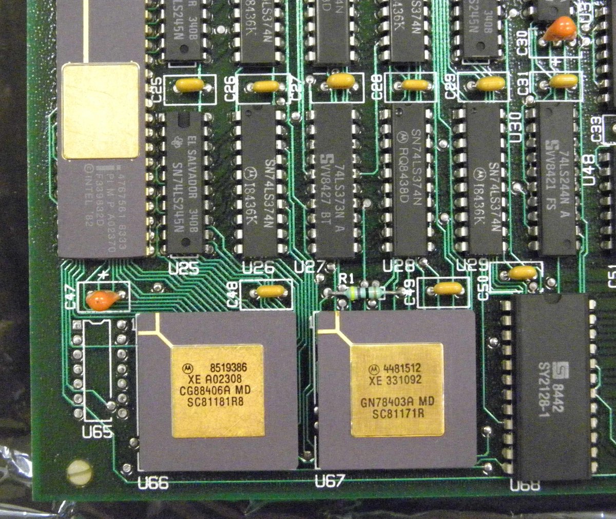 U66 (on the left) is also a Motorola 68K processor. but something is different--the microcode inside has been changed so that it doesn't run regular 68K code. instead it decodes and runs IBM System 370 code! well, most of it.