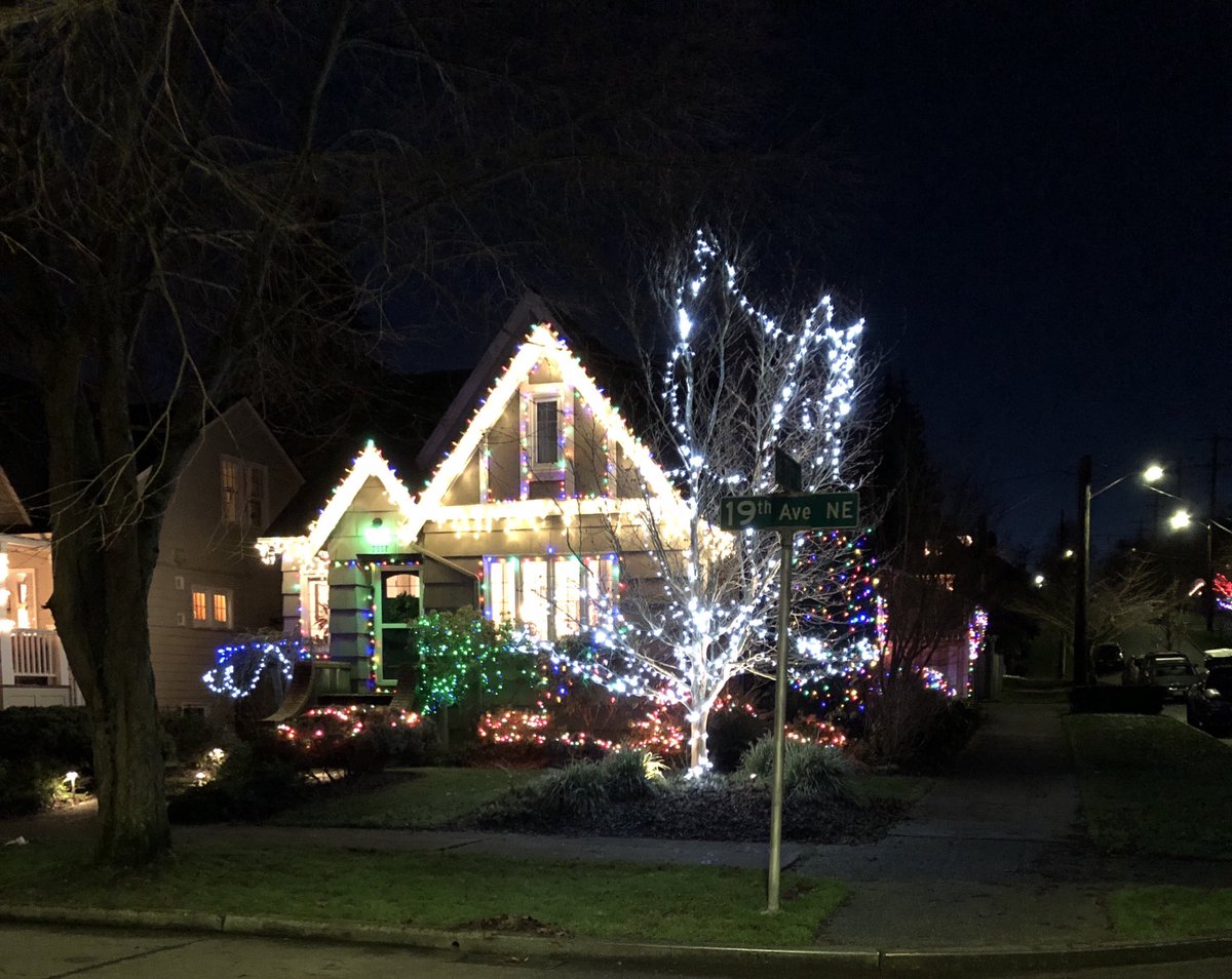 I promised  @NerdPyle some technicolor holiday lights, since his dog walk strolls through Seattle’s posher zip codes offer mostly tasteful warm white lights. Let’s get started with a corner house. All lights more vivid IRL. Thanks iPhone.