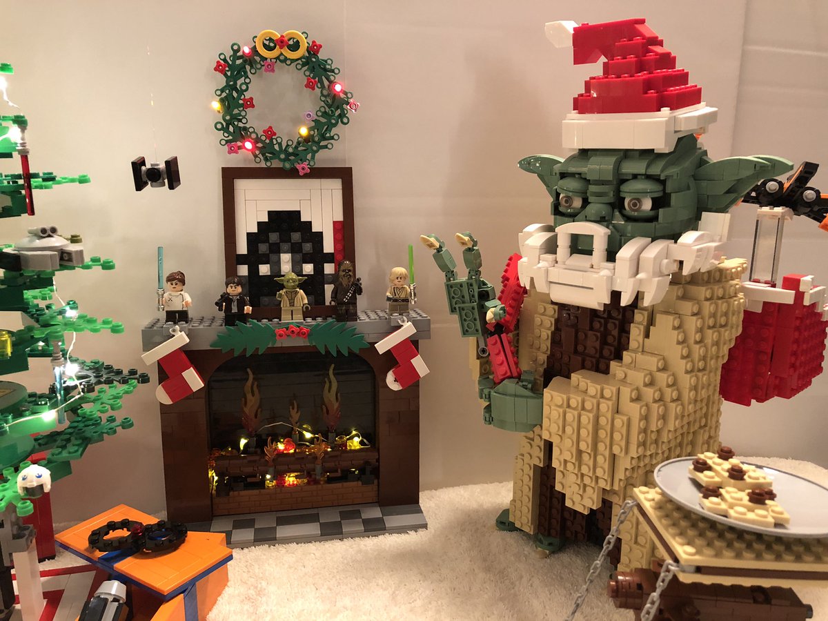 My son & I put together this Xmas gathering of Yoda Claus and Frosty 8 around the Lightsaber Xmas tree. Rebel bomber tensegrity table w/cookies, rebel stocking hangers, Yoda using force to add 1 more ornament & X wing toy flying out of present bag. #LEGOStarWarsHolidayContest