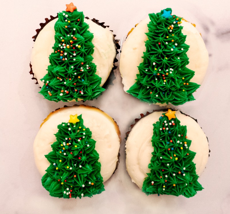 ElisCheesecake's tweet photo. Now you can have your Christmas Tree and eat it too! 4 chocolate cupcakes with vanilla buttercream and a hand-piped Christmas tree. 🎄 

Shop the perfect Holiday gift or treat for yourself: https://t.co/tCN1zAJORX https://t.co/QJaFVNkclC