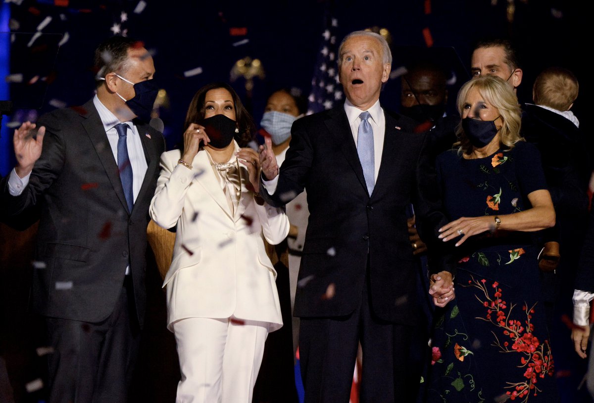 Democratic 2020 U.S. presidential nominee Joe Biden and his wife Jill, and Democratic 2020 U.S. vice presidential nominee Kamala Harris and her husband Doug, react after the news media announced that Biden has won the 2020 U.S. presidential election JIM BOURG