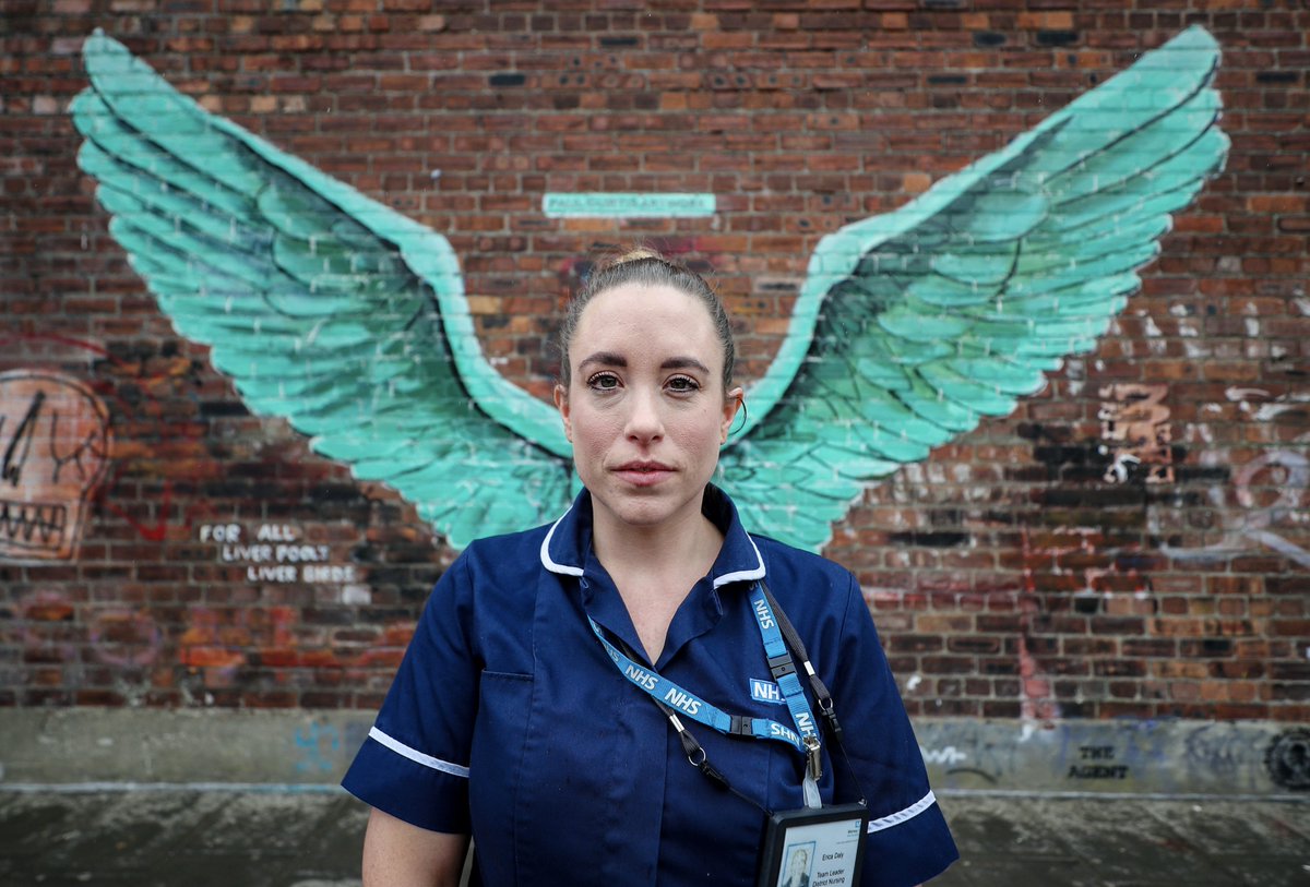 Erica Daly, a District Nurse Team Leader at Mersey Care NHS, standing in front of the 'Liver Bird Wings', an artwork by Paul Curtis on a wall within Liverpool's Baltic Triangle. @Peter_J_Byrne / PA