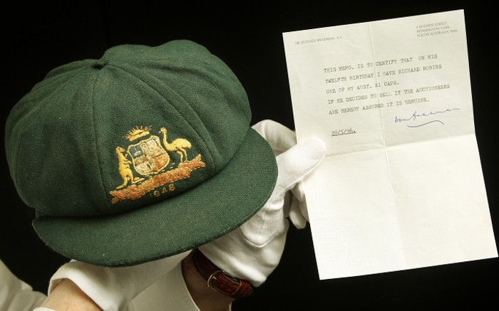 Don Bradman's debut 'baggy green' cap sold for record Aus$450,000