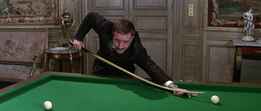 What's happening - Inspector Clouseau is trying to put the snooker cue away #ashotinthedark