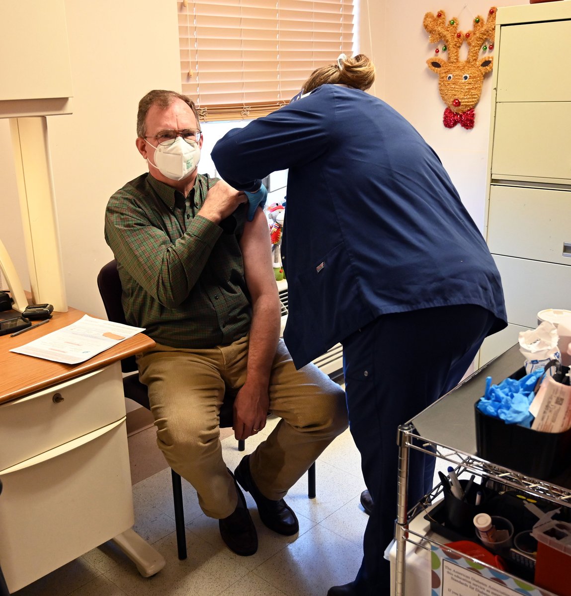 AsheHospital's tweet photo. Ashe Memorial Hospital administered its first doses of the Moderna COVID-19 Vaccine to its frontline health care workers today. Dr. Charles Jones, a general surgeon, was the first Ashe Memorial Hospital employee to receive the vaccine. @moderna_tx @AshePostTimes @wsoctv https://t.co/pMWjqDzjLn