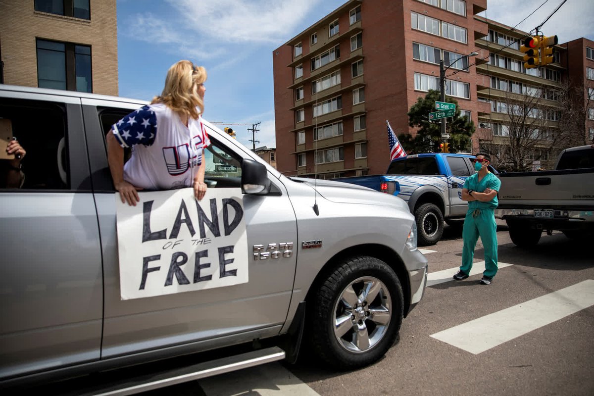 - April 19 -A health care worker stands in a Denver street, counterprotesting a rally where people were demanding that stay-at-home orders be lifted.  https://cnn.it/3lXJBdf&nbsp;