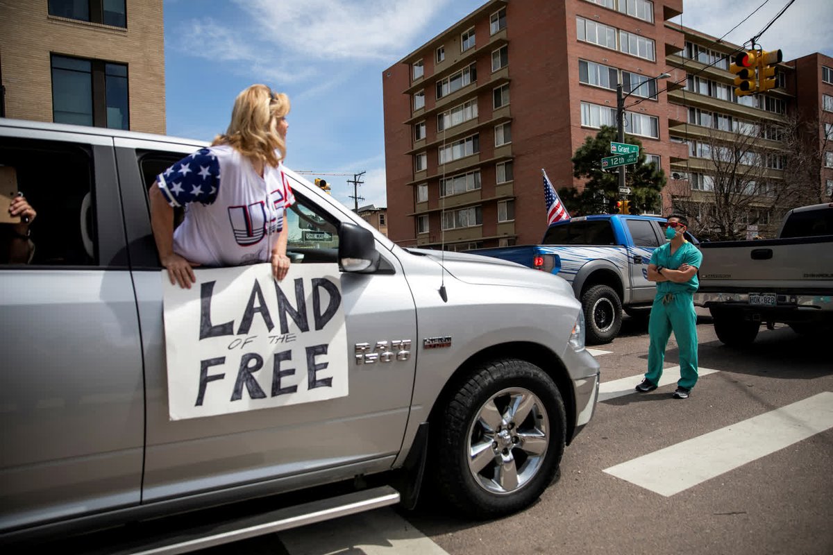 - April 19 -A health care worker stands in a Denver street, counterprotesting a rally where people were demanding that stay-at-home orders be lifted.  https://cnn.it/3lXJBdf 