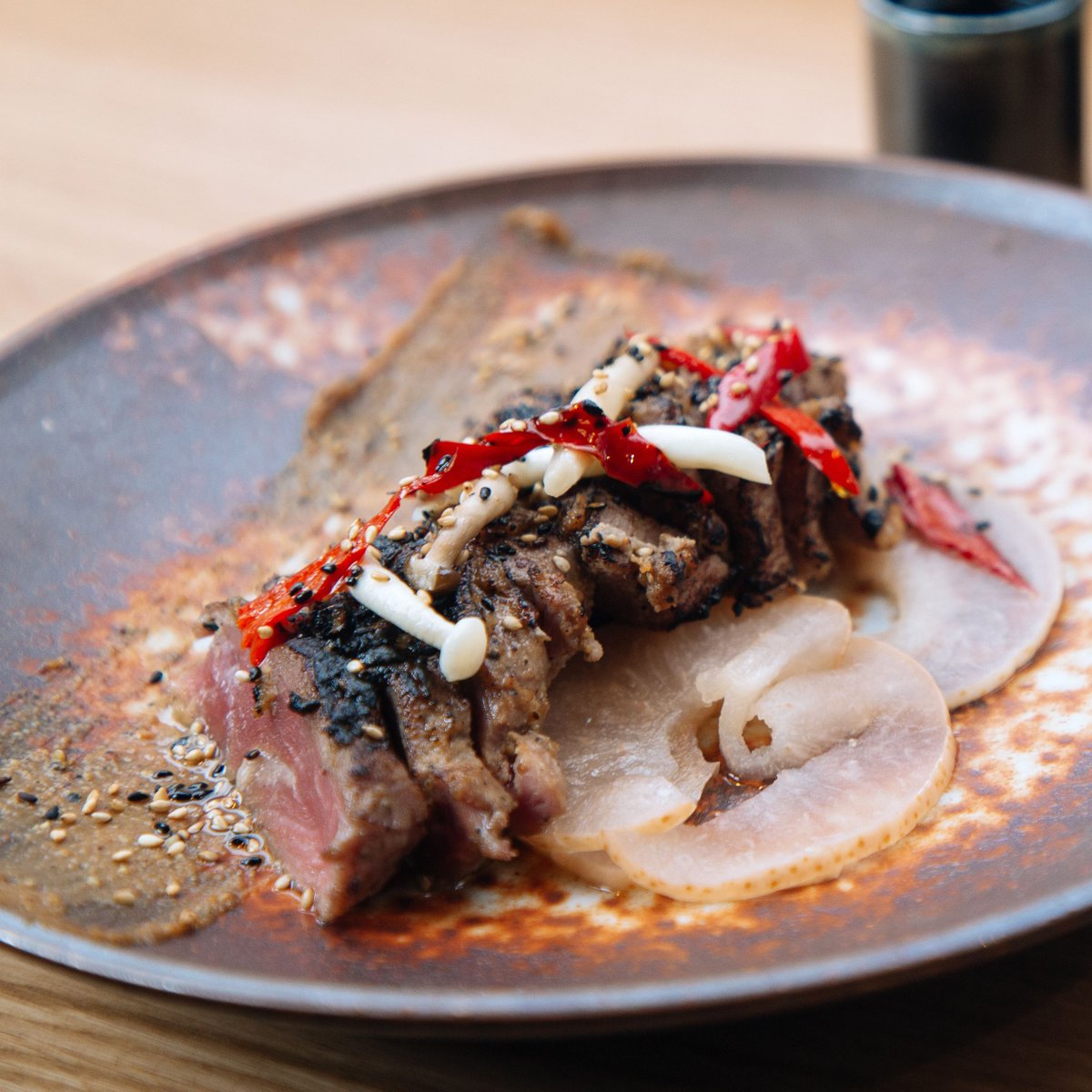 robatasoho's tweet photo. What ROBATA dish do you miss the most right now? Is it our Wood Flamed Iberico Pork Pluma served with black pepper &amp; sweet pickled green apple. 🔥 🔥 #robatasoho

Click the link in our bio to make a reservation at a later date ❤️ https://t.co/GoVFrAhG07