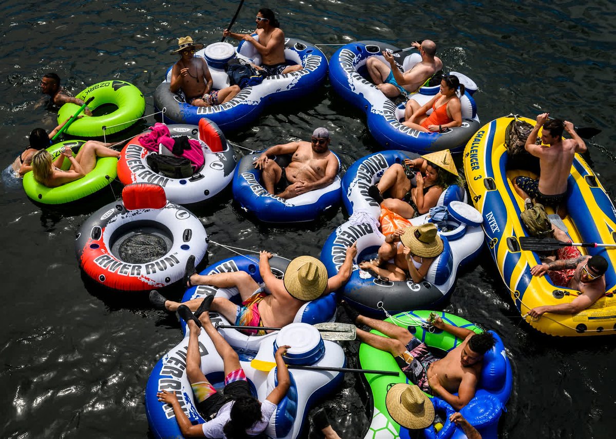 - May 24 -A group floats down the American River near Rancho Cordova, California. Memorial Day weekend prompted plenty of celebrations at the beach and boardwalks, but few were seen social distancing or wearing masks.  https://cnn.it/3lXJBdf 