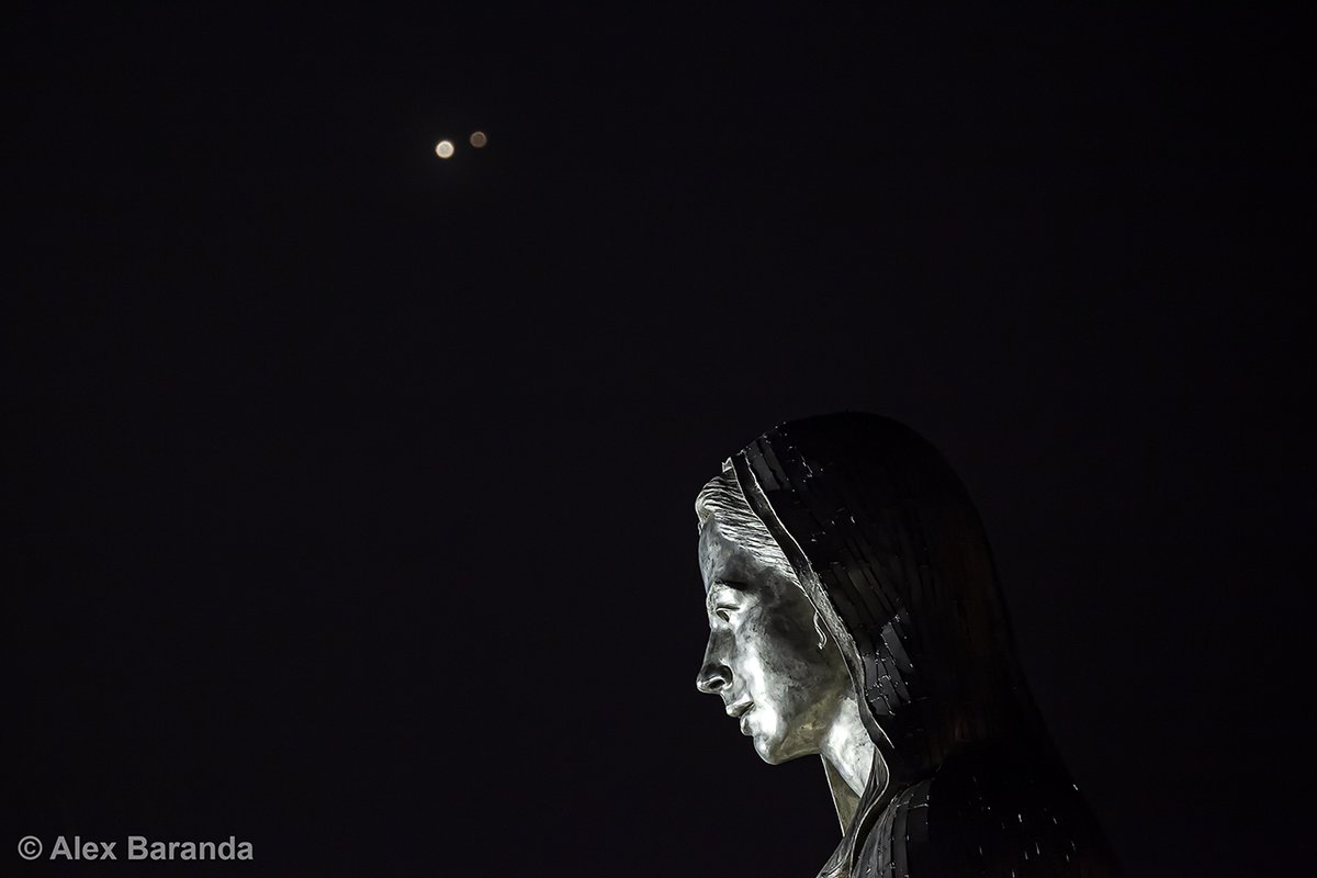 qu2rk's tweet photo. Jupiter and Saturn (out of focus) appear within a tenth of a degree in the sky over the Our Lady of Silicon Valley in Santa Clara, California. #photography #jupiter #saturn #conjunction #ourladyofpeace #santaclara #california 
#greatconjunction2020 https://t.co/S5dZs9UBHF