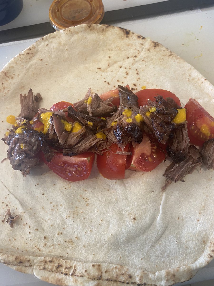 Holy bananas that stuff is spicy. Here it is while I’m assembling my leftover pot roast pita wrap. I added more sauce later.