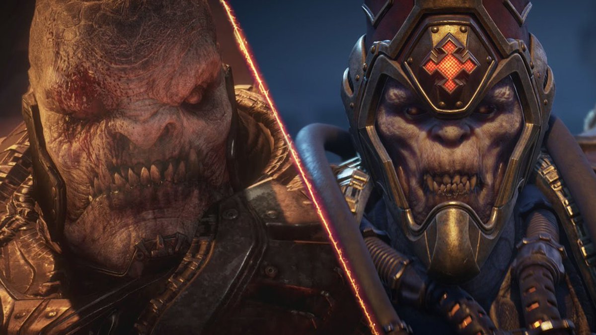 Split image with close up of RAAM's face on the left and Ukkon's face on the right. Both are seperated by a line of flames. Both characters have an angry expression with their teeth showing. 
