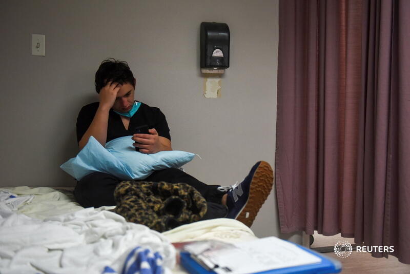 The emotional toll of the death of a patient evident on the face of Gabriel Cervera as he notifies the family. Photos by  @callaghanohare