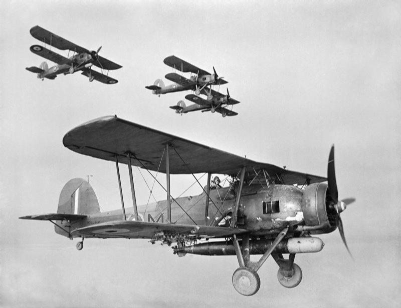 As well as the air strike on the convoy, HMS Illustrious also launched the Fairey Swordfish of  @815NAS & 819 NAS against Tripoli harbour, hitting shipping & warehouses, aided by additional Swordfish of 830 NAS from Malta, which laid mines in the harbour entrance.