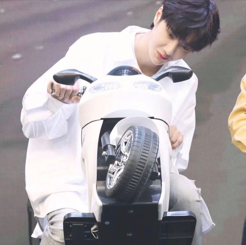 Tiny babie with his tiny motorcycle 