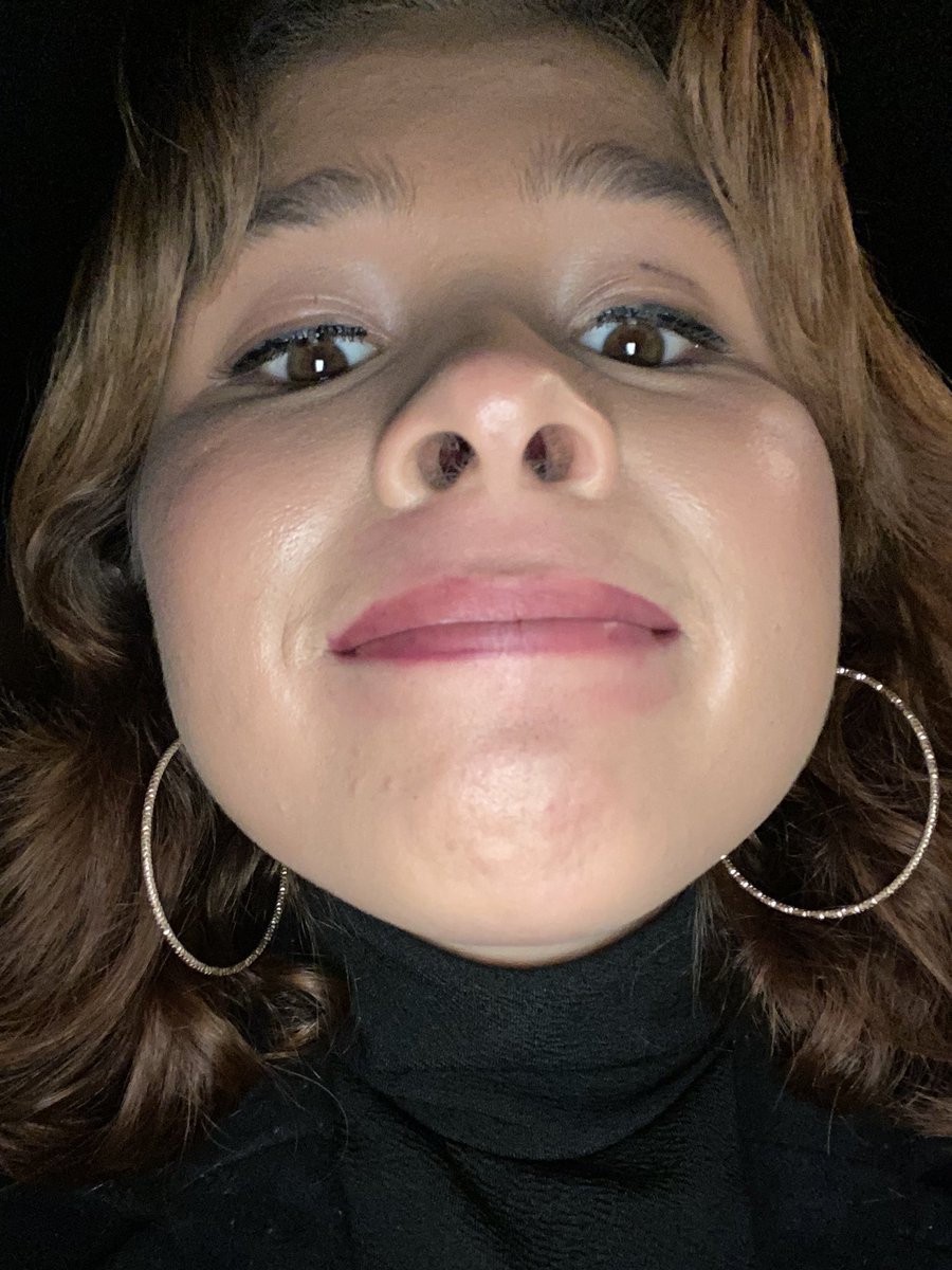 Me checking my makeup on my phone  before the Christmas party.