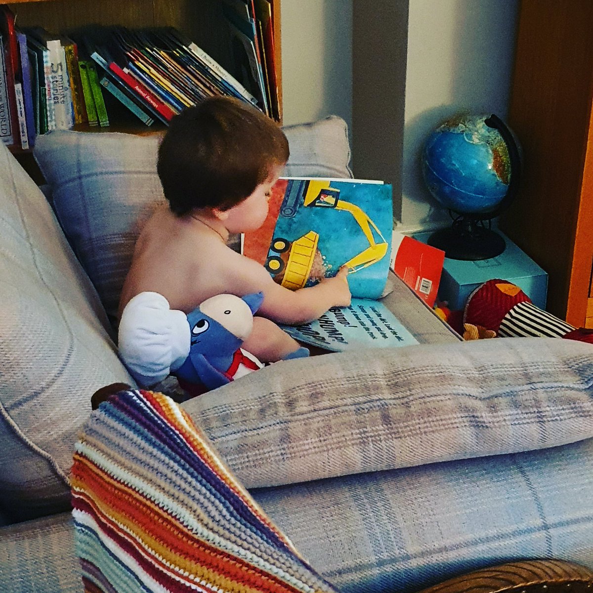 rossmckinley's tweet photo. Absolutely love the fact that Toby enjoys books so much. Wandered into his room as he was sat, no clothes, reading Eeyore his book on how to build a road. #prouddad #thjm #readingforlife #roadworks #eeyore #readingtofriends #isolationreading @Literacy_Trust @jimrockslots https://t.co/eBmg9M4JqI