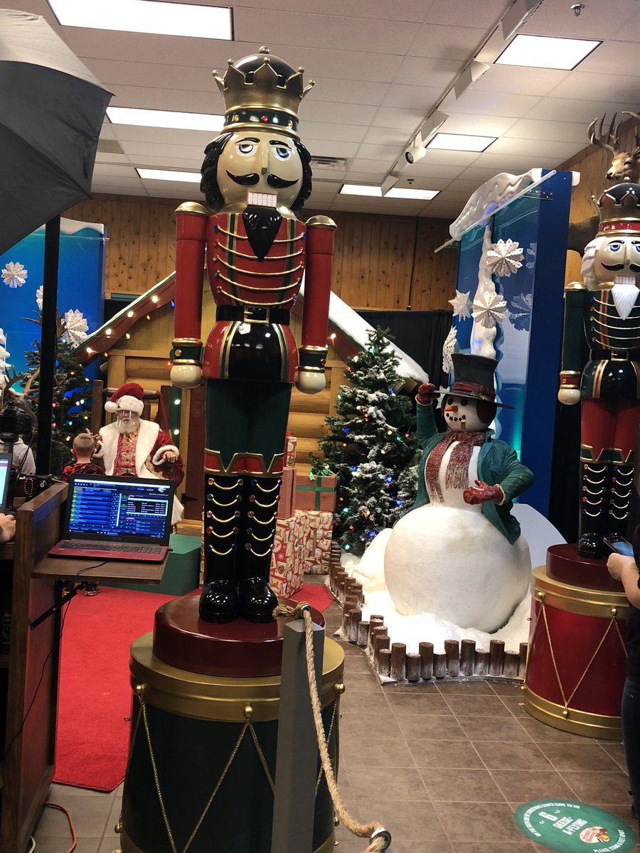 After wandering past a few killing fields and discounted gun safes, we arrived at Santa’s mobile workshop. Santa is guarded by nutcrackers at attention and also a plexiglass wall and face shield. In the at risk population, evidently. Or perhaps he’s an asymptomatic carrier.