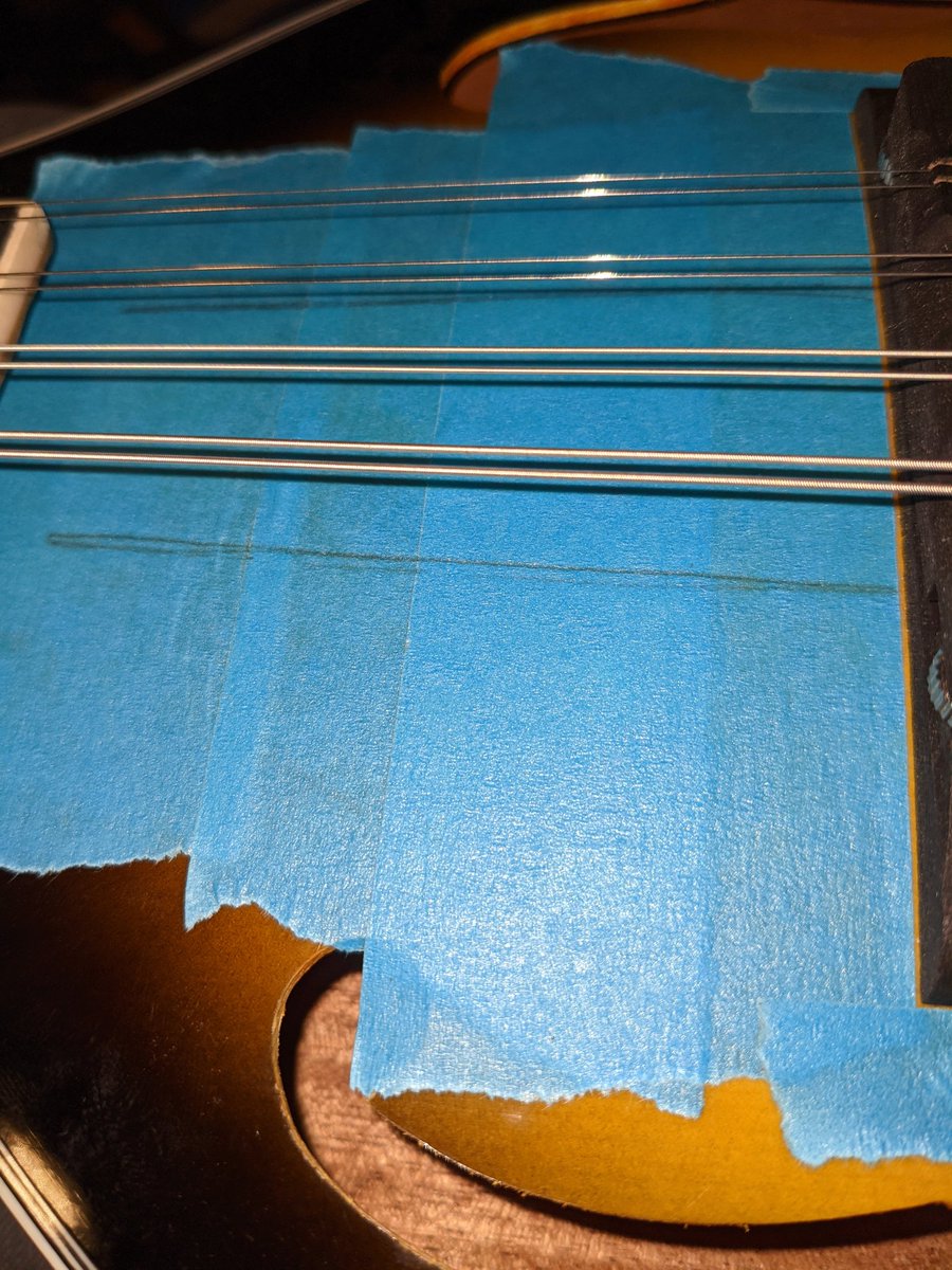 Taped up and outside strings marked to help centring the Pup.....