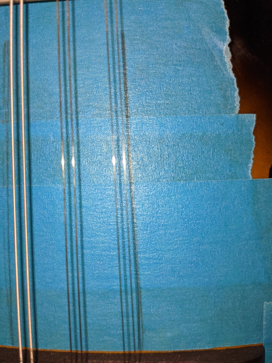 Taped up and outside strings marked to help centring the Pup.....