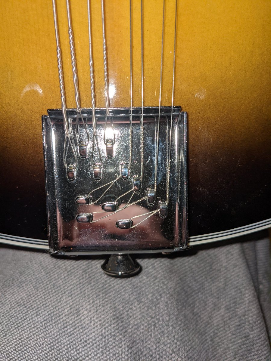 Stupid f*cking system to anchor the strings... Actually it's clever and cheap.. Run the metal through a press. The musical equivalent of a cut nail. But really badly done.. I'll have to improve these for easier restringing...