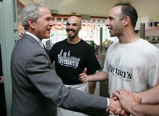 CLEHistory's tweet image. President George W. Bush greeted by staff members Samir Elnahass and Freddie Slyman upon his arrival at Cleveland’s Slyman’s Deli.   7/10/2007.   

@SlymansClevBest