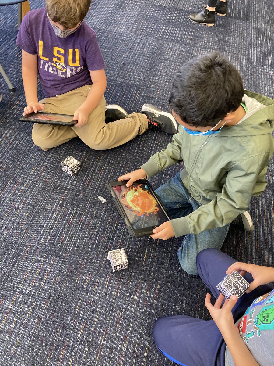 HydeCommons's tweet photo. It was a ton of fun introducing our 3rd graders to the merge cube and watching them learn about the solar system in a whole new way!  Thank you @shannonmmiller for your Merge Cube template tip you shared in your blog. @HydeElementary @CCISDLibrary #ccisdlibs #mergecube https://t.co/4B9GVcQGIM