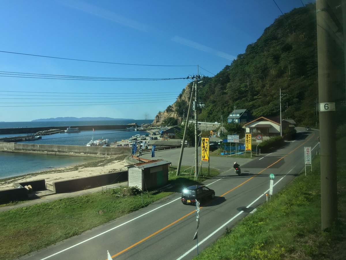 And I do mean up the coast: after a brief section on the plains north of Niigata, the Uetsu Main Line hugs the coast, with beautiful coves, cypress-covered outcroppings, and the deep blue sea.(Taking photographs of this is, as usual from trains, difficult!)