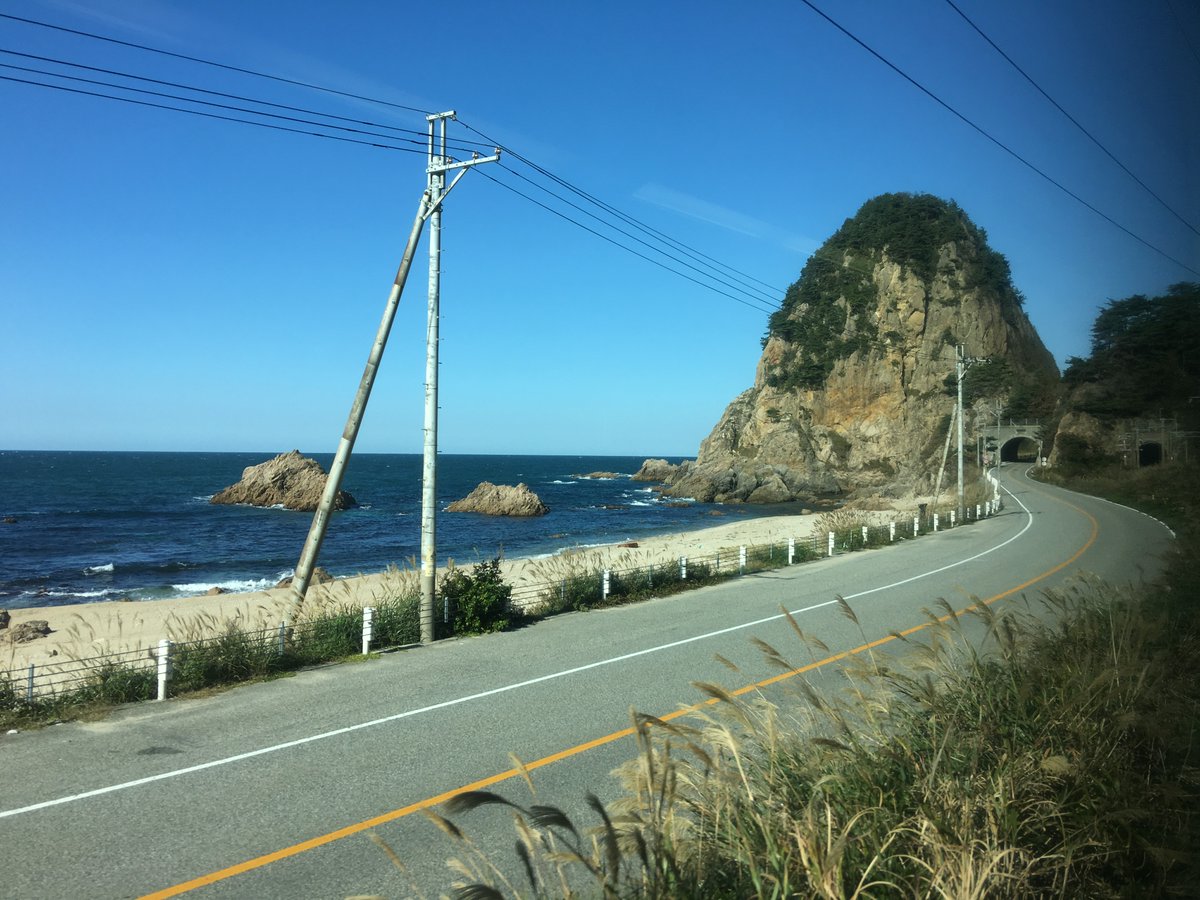And I do mean up the coast: after a brief section on the plains north of Niigata, the Uetsu Main Line hugs the coast, with beautiful coves, cypress-covered outcroppings, and the deep blue sea.(Taking photographs of this is, as usual from trains, difficult!)