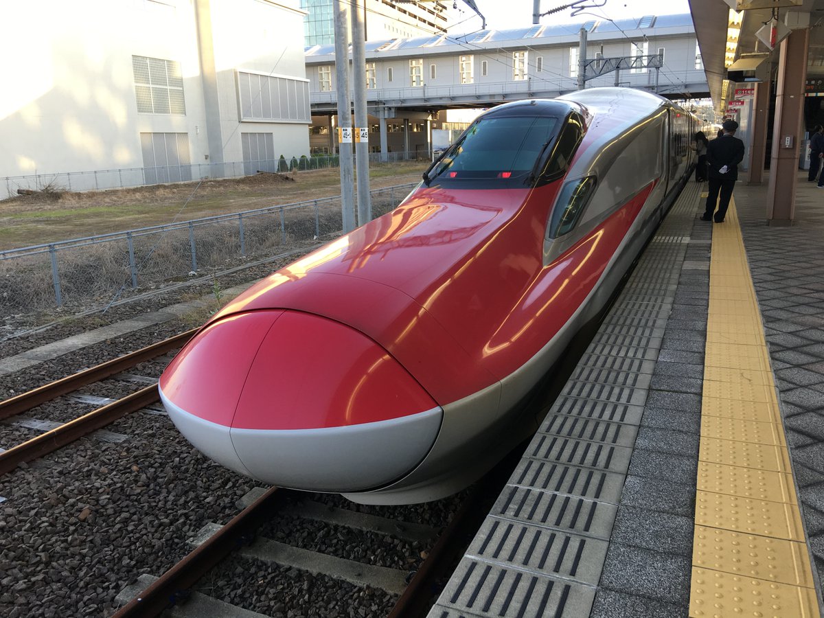 "Mini-Shinkansen" refers to the older conventional lines, where the track gauge (distance between rails) was widened to take the Shinkansen, but the loading gauge (size of train car) wasn't.Look at the wider standard-gauge track the E6 uses, and the narrow-gauge next to it.