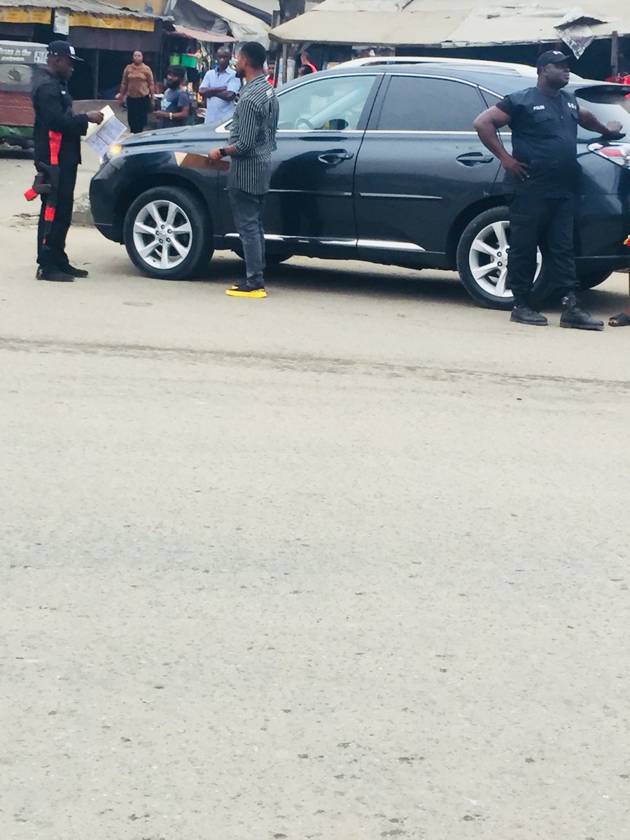 colsblend's tweet photo. On my way back from work today, I saw this group of police officers tagged as RRS on the road conducting stop and search operations which had been banned by the IG of police. The main issue here is that they’re still harassing the youth as you can see from the pictures.#EndSARS https://t.co/IwxP1rwP0L