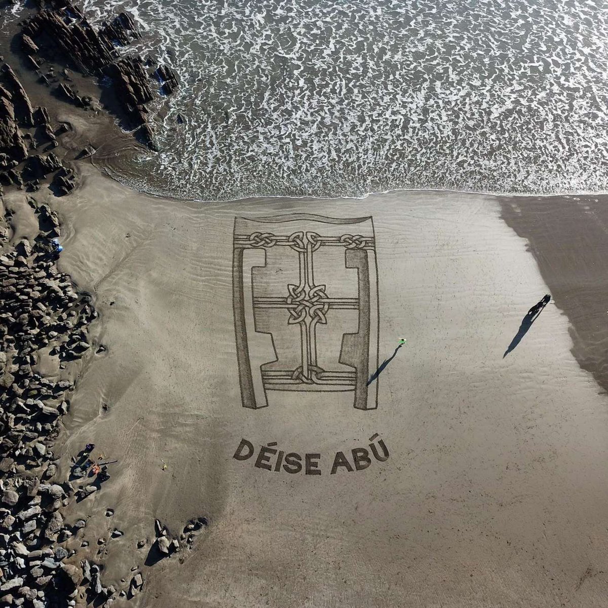 WaterfordGAA's tweet photo. Some great sand art down on Clonea beach, Dungarvan today!

⚪🔵

#FanWall #BestSeatInTheHouse https://t.co/LH40yluVW2