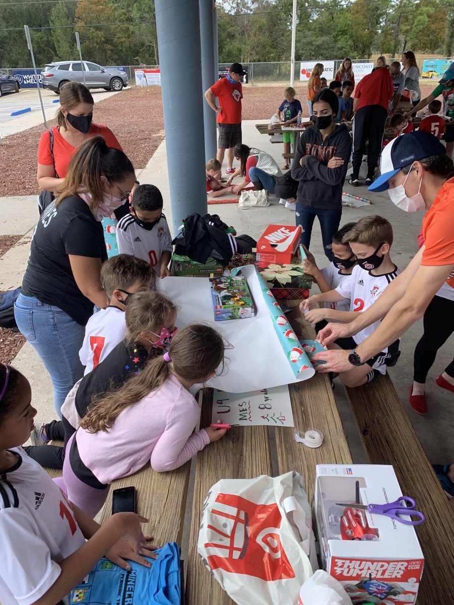 hernandosoccer's tweet photo. FHYSC players, coaches and parents are wrapping Christmas gifts for families and children in our community! #wecare #givingback #welovehernando https://t.co/q3VvPrFm6e