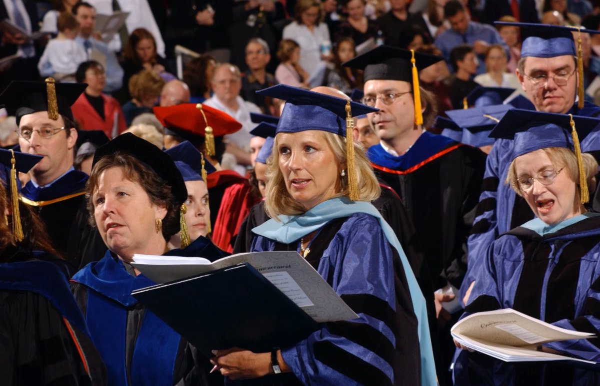 Dr Jill Biden in the dress robe and hood of a Doctor of Education of the  University of Delaware, 2007. The hood is faced with light blue,  representing the field of study,