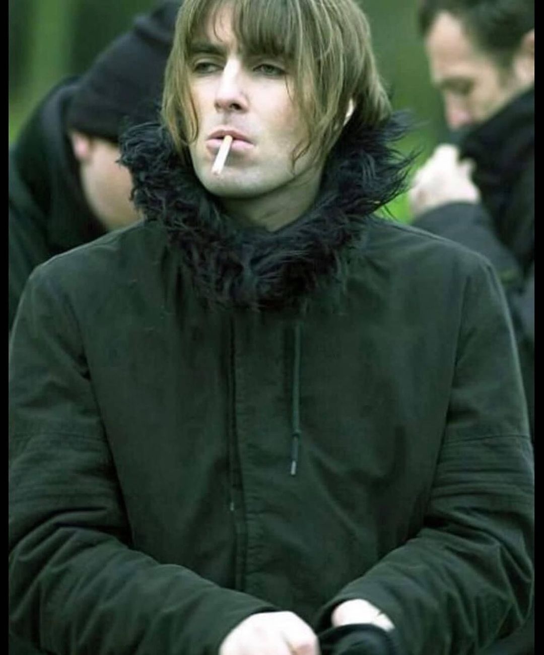 GRAILED on X: Liam Gallagher wearing the Helmut Lang A/W 1999 Astro Parka  on the set of the Songbird music video 🎥  / X