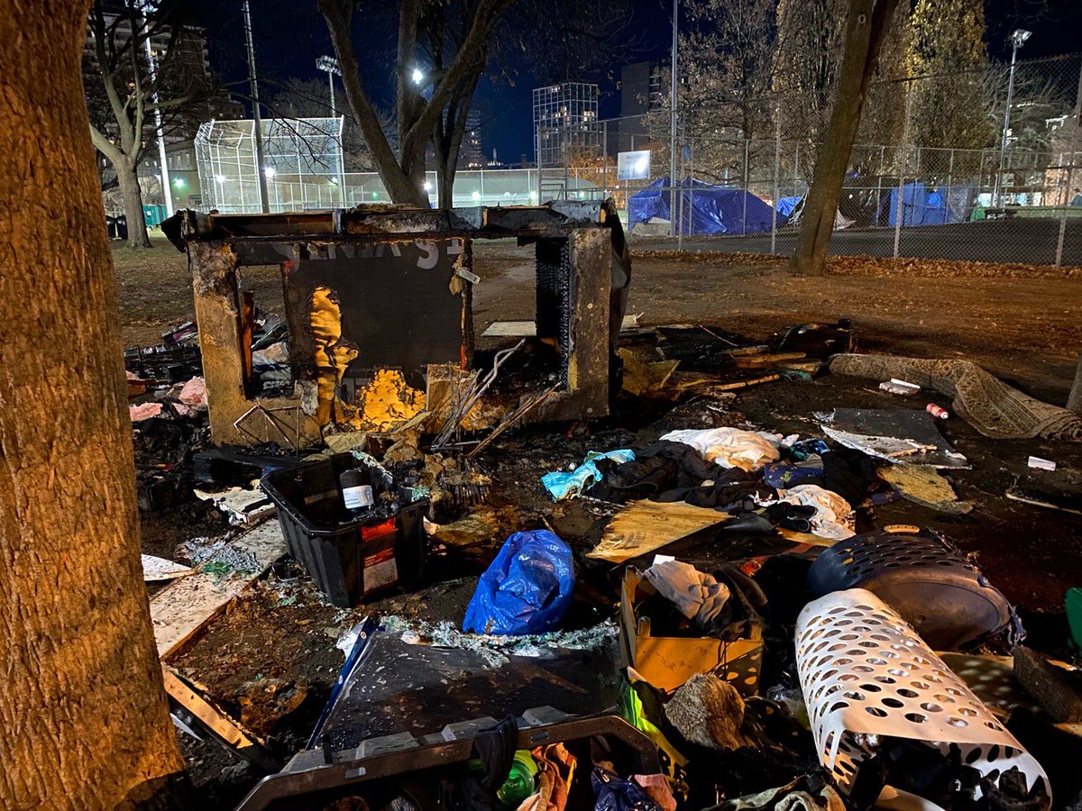 2. On Monday before midnight someone lit a tiny house in Moss Park on fire beginning with tarps on outside/top of structure. Quarrel before loud bang bang. White guy, scruffy beard left scene. Police and fire attended. Police told Sun it remained under investigation.