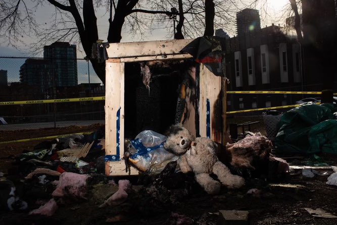 2. On Monday before midnight someone lit a tiny house in Moss Park on fire beginning with tarps on outside/top of structure. Quarrel before loud bang bang. White guy, scruffy beard left scene. Police and fire attended. Police told Sun it remained under investigation.