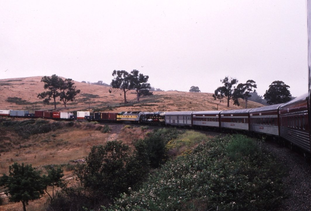 Tunnel down side km 40 Yantaringa Curve Adelaide Hills Up Overland Express CLP 15 assisting Up NR FreightWeston Langford 20 December 1996 https://www.westonlangford.com/images/photo/121327/Weston was fortunate to be onboard the Overland this day ... Freighter stalled?