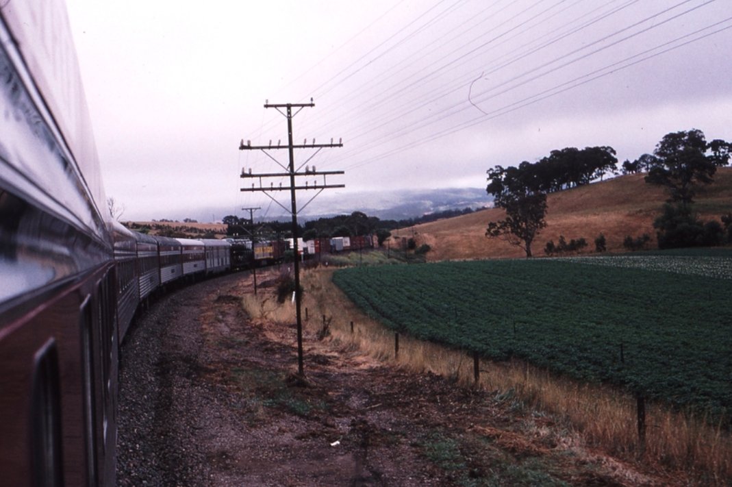 Mount Barker Junction up side km 49.5 Up Overland Express CLP 15 Assisting Up NR FreightWeston Langford 20 December 1996 https://www.westonlangford.com/images/photo/121323/